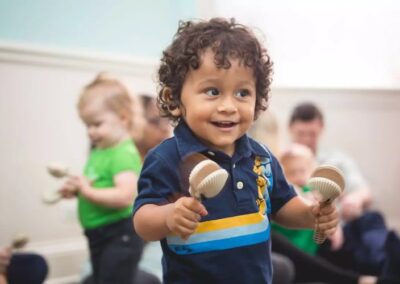 Picture of a one year old holding an instrument