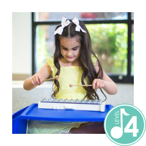 Image of four year old on a xylophone